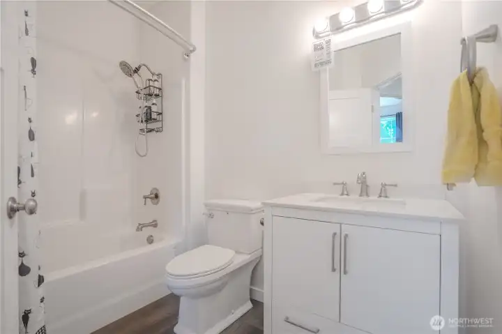 The full bath for guests and bedrooms 2 and 3.