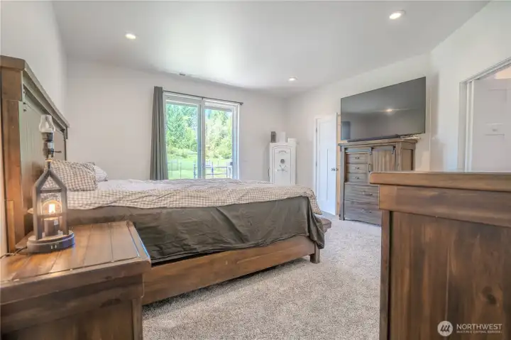 Primary bedroom with walkout to pasture.  Pastures have several paddock areas to rotate livestock or provide separate quarters.