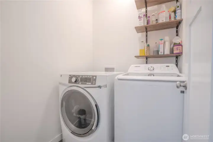 Utility/laundry room adjacent to primary bedroom.