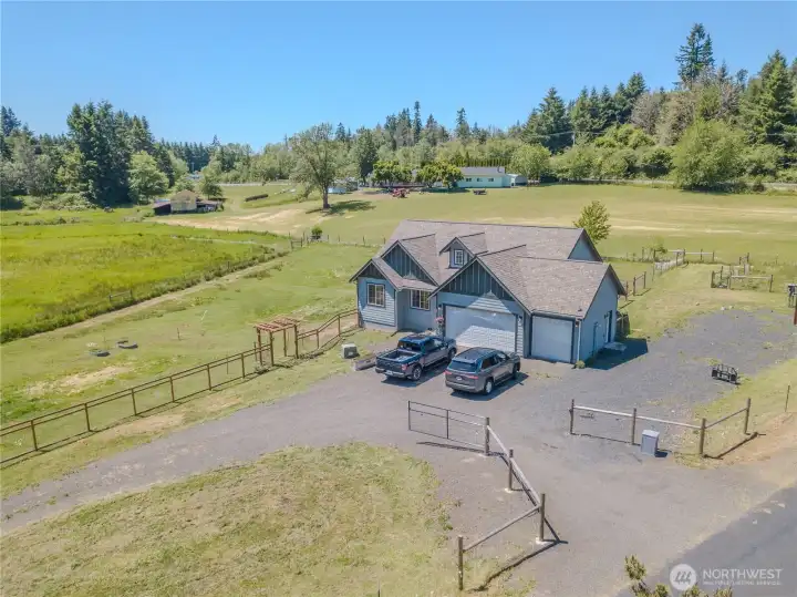 The entire property is fenced - including a circular front drive .