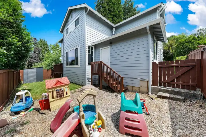 Back yard w/deck of bonus/3rd car garage