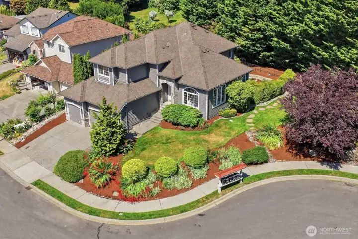 Beautifully established landscaping surrounds the home, offering vibrant colors, lush greenery, and a picturesque backdrop to enjoy throughout the seasons. Beautifully established landscaping surrounds the home, offering vibrant colors, lush greenery, and a picturesque backdrop to enjoy throughout the seasons.