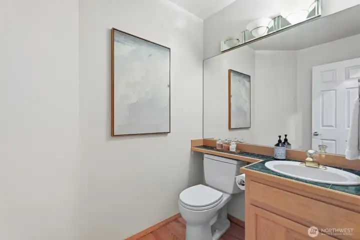 Conveniently located on the main level, the half bath offers comfort and accessibility. Conveniently located on the main level, the half bath offers comfort and accessibility.