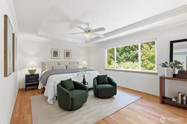 The grand primary bedroom offers a serene escape with generous space, elegant architectural details, and large windows that fill the room with natural light. The grand primary bedroom offers a serene escape with generous space, elegant architectural details, and large windows that fill the room with natural light.