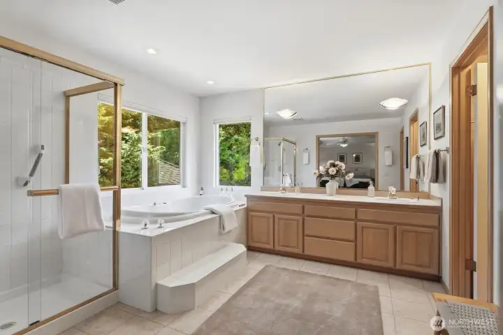 Primary bathroom, featuring a luxurious jetted tub, generous space, and a bright, inviting atmosphere perfect for unwinding at the end of the day Primary bathroom, featuring a luxurious jetted tub, generous space, and a bright, inviting atmosphere perfect for unwinding at the end of the day