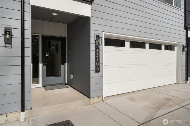 Welcome home! This sleek and stylish entrance sets the tone for modern living. Step through the front door and into your dream space with an oversized 2-car EV-ready garage for all your parking and storage needs!