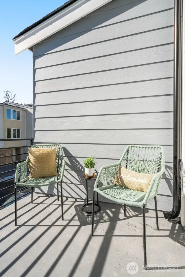 Imagine starting your day with coffee, soaking up the fresh air on this private balcony. Whether it’s a peaceful moment alone or a chat with a friend, this charming outdoor retreat is the perfect escape.