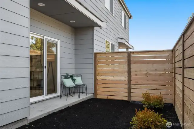 A private fenced patio with room for outdoor seating is perfect for morning coffee or evening relaxation in your secluded space.