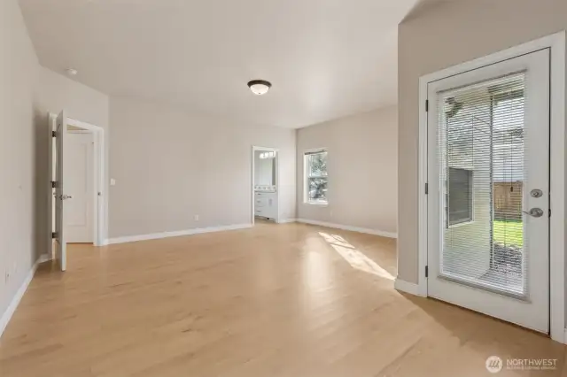 Enormous primary bedroom with sitting area, 5 pc bath with walk-in closet, double sinks, soaking tub, shower and water closet; Plus access to private covered patio.