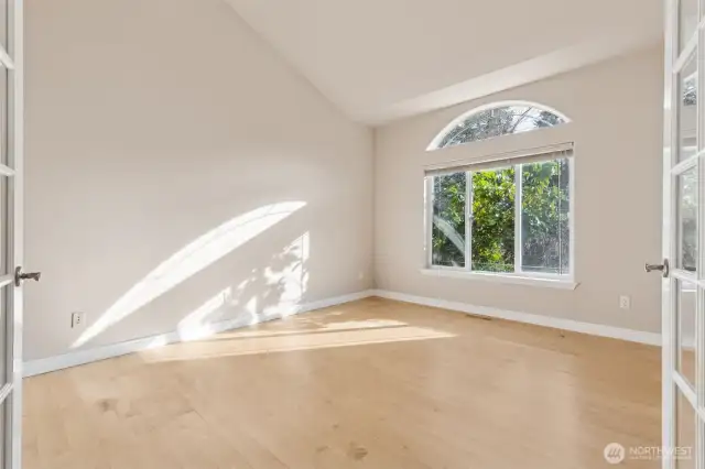 Generous study, natural light, french doors. Located near entry to the home.