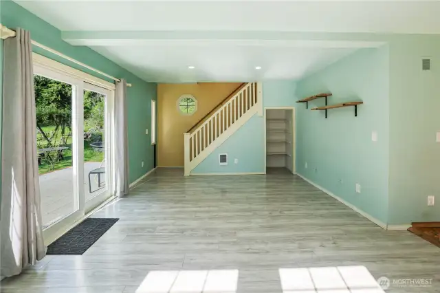 Living room with sliding glass door and storage