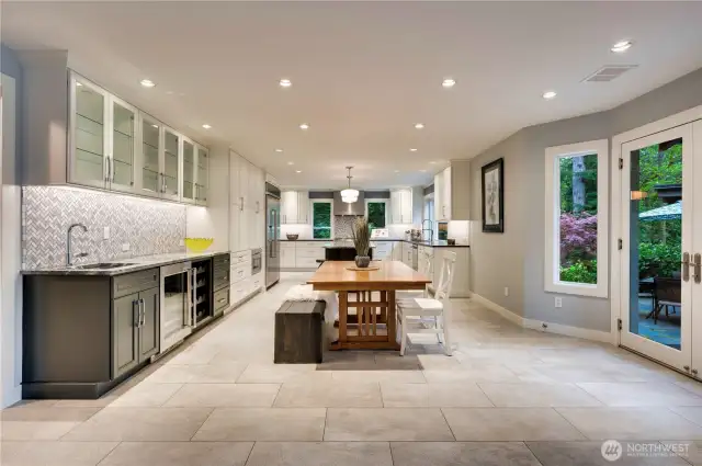Dining area adjacent to kitchen and wet bar.
