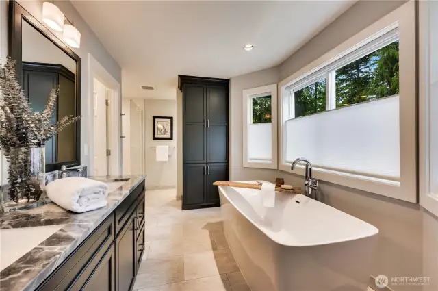Spectacular 5 piece bath centered on this lovely soaking tub with a view.