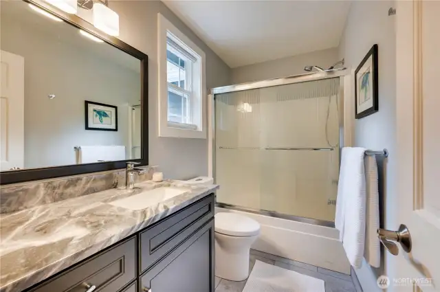 Full bath for Bedrooms 3  & 4.