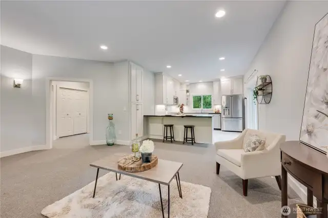 Roomy living area adjoins kitchen.  One bedroom on each side of the utility area doors you see to the left. 42" entry door and 36" interior for easy wheelchair access.