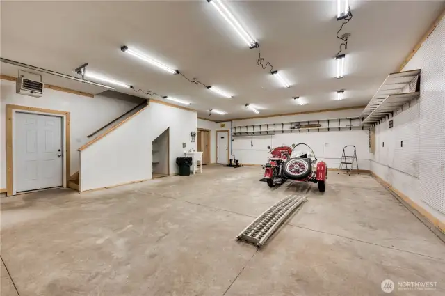Shop/garage with tons of storage.  If you don't have a classic 1950's Harley with a sidecar, what could you have here?
