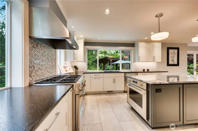 Kitchen with facing convection oven & convection range. One gas and one electric.