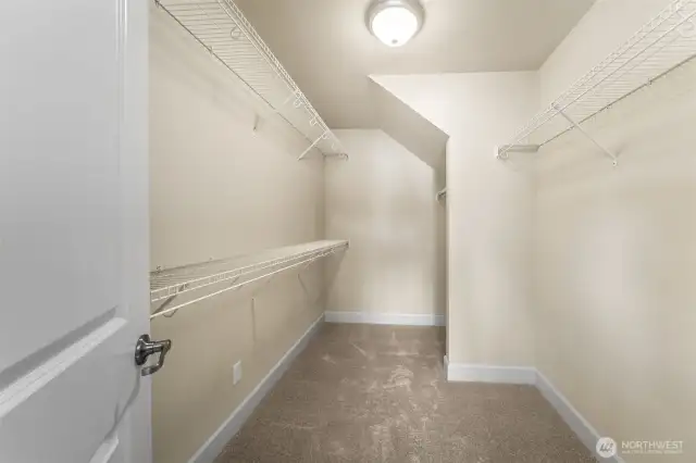 Walk-in closet in primary ensuite.