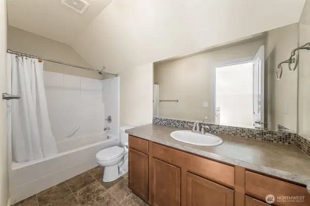 Full bath on the 3rd level connected to the bonus room.