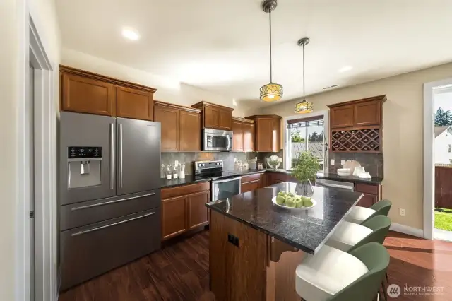 Amazing kitchen w/bar area and plenty of cabinets. Walk-in pantry too.  (virtually staged)
