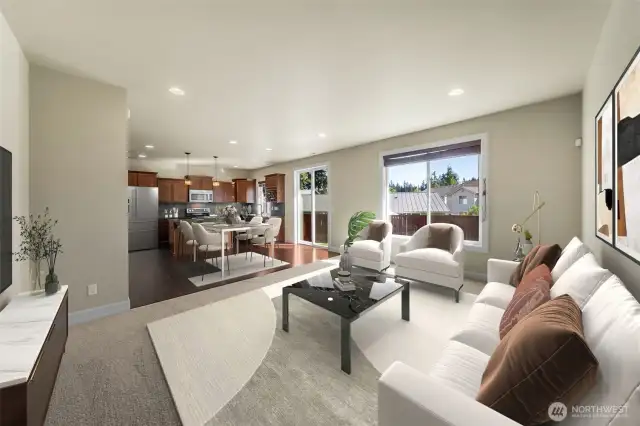 View of family room back to the eating area and kitchen. (virtually staged)