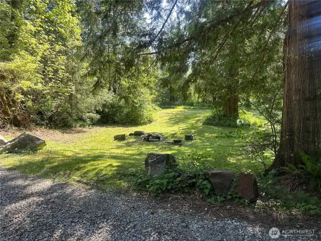 Area around outbuilding and below house