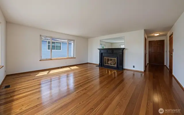 VIRTUAL RENDERING. Hardwood floors on the main floor of the home.