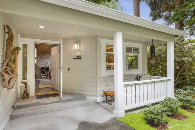 Cozy covered front porch welcomes you inside.