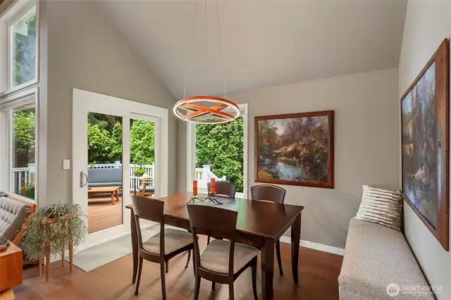 Wonderful dining space with high ceilings opens onto a private deck.