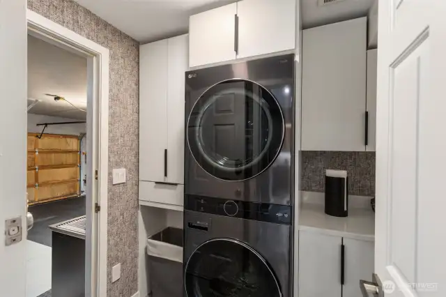 This handy laundry room looks good, too! There is room for everything, and it provides a mud room area adjacent to the garage.