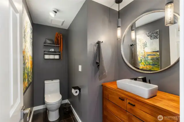 Beautiful updated powder room on the main floor, with new fixtures and lighting.