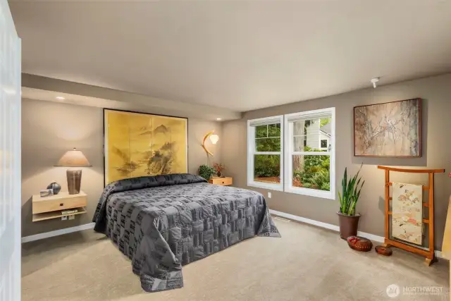 The primary suite features new carpet and paint, lovely windows provide the serene view and natural light.