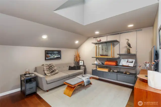 Upstairs, a roomy loft with skylight and hardwood floors provides a den space, office, media room or hobby space.