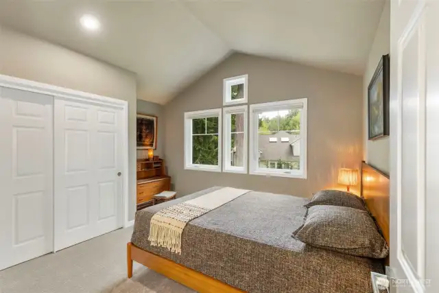 The 2nd bedroom, with large closet and pretty windows taking in the views.