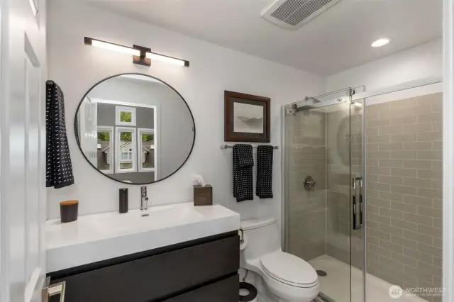Stylish design and functionality shine in this updated 3/4 ensuite bath off the 2nd bedroom.