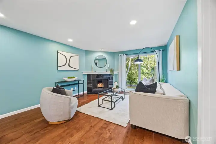 Engineered hardwood flooring flows throughout