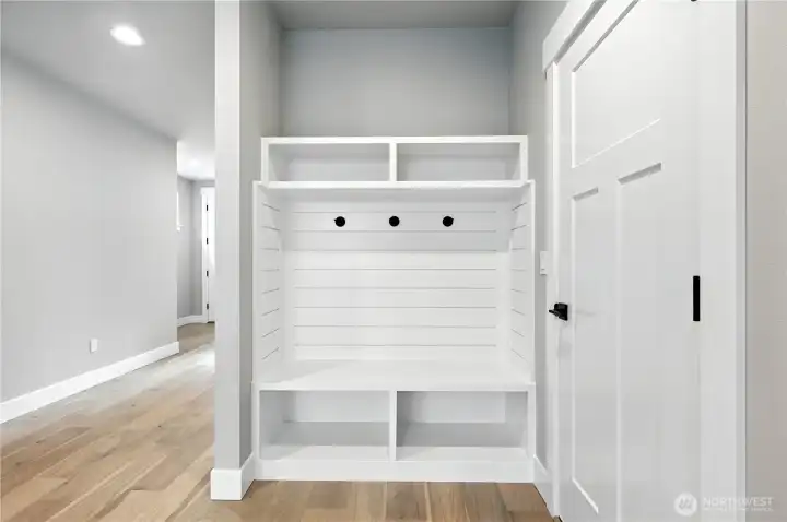 entry from garage  photo of  completed home on another lot.