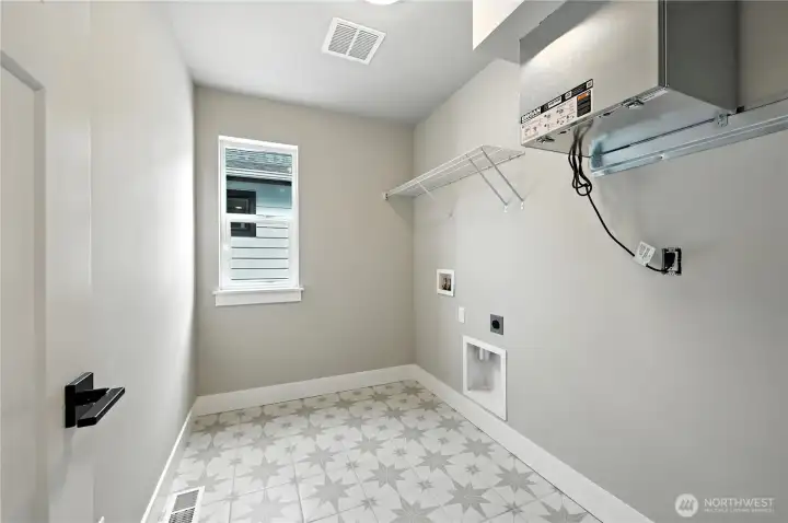 Laundry  photo of  completed home on another lot.