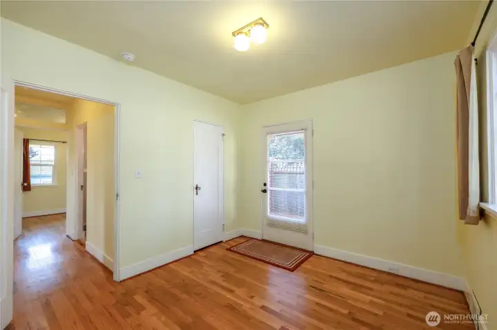 View of the 1st bedroom with the exterior door.
