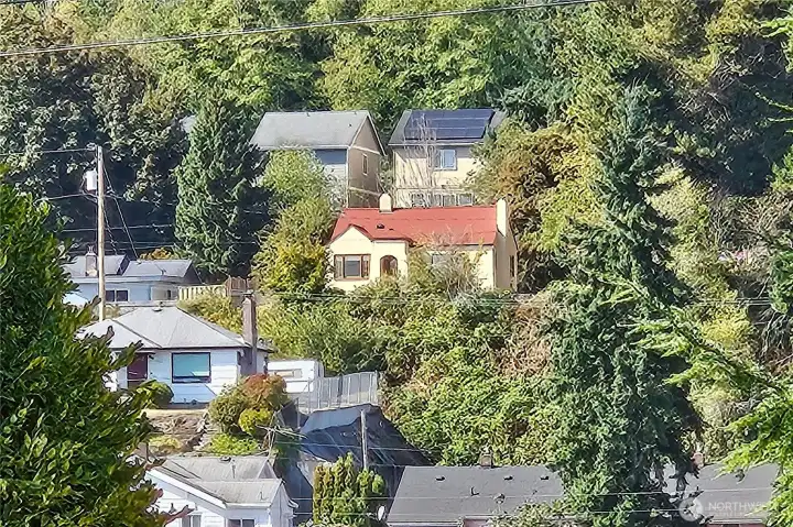 Tucked away up on a hill sits a pretty home with a warm and inviting vibe!