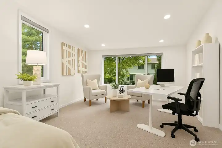 Primary bedroom with sitting room (virtually staged as an office space) and ensuite bathroom.