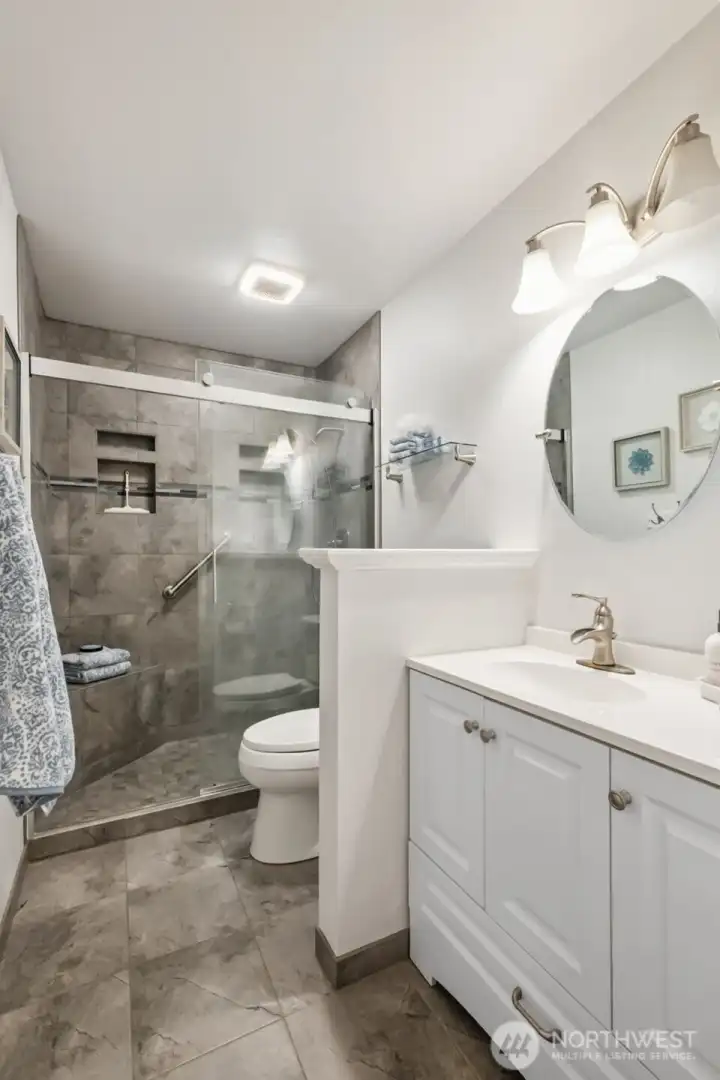 Updated lower level 3/4 bathroom with large walk-in shower!