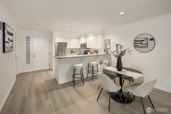 As you enter the condo, you are greeted by a light and bright open floor plan.