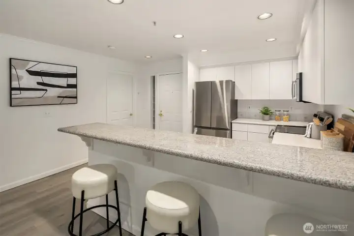 Comfortable bar counter seating for your morning coffee or casual meals.