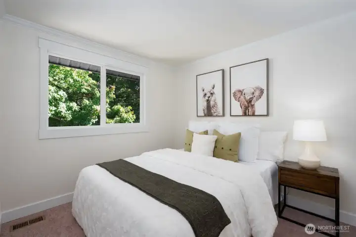 Current photo reflects the guest bedroom when the home was previously staged.