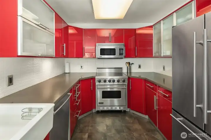 Kitchen features high end appliances and updated cabinetry