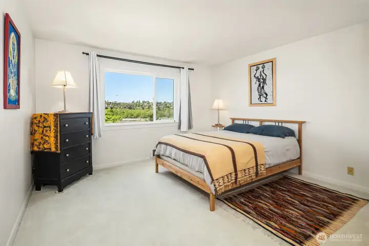 The primary bedroom is exceptionally spacious, offering a generous and comfortable living area that is perfect for relaxation and rest.