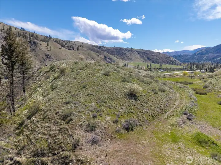 Ideal setting for privacy, views, and easy access to town.