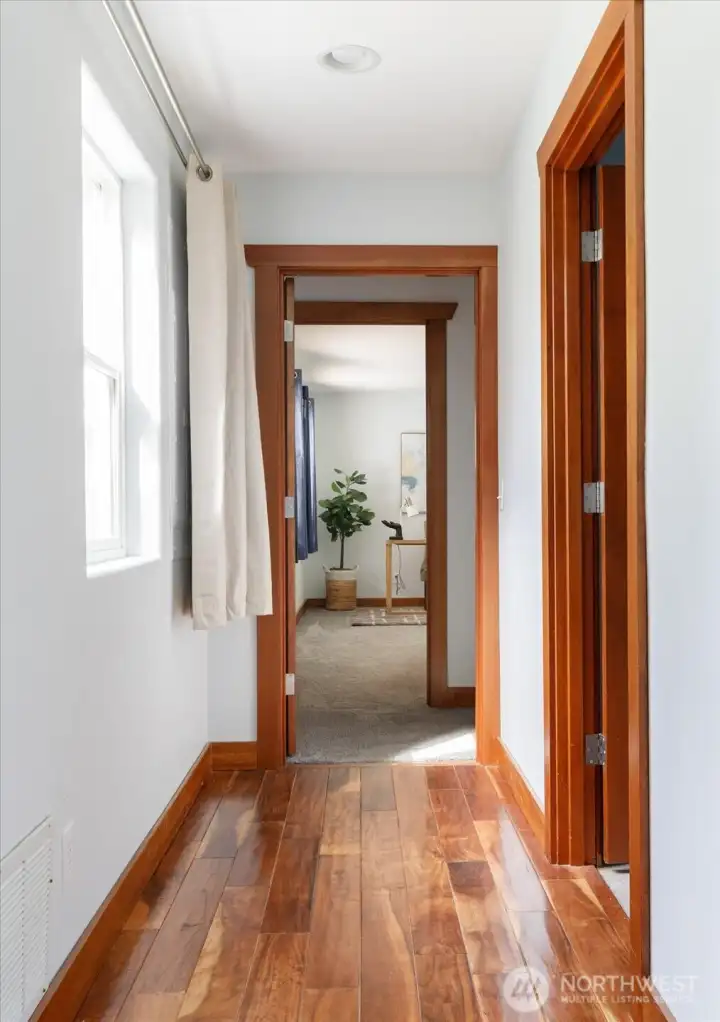 Down the hall from the entry is the office/den, main level bedroom and bath