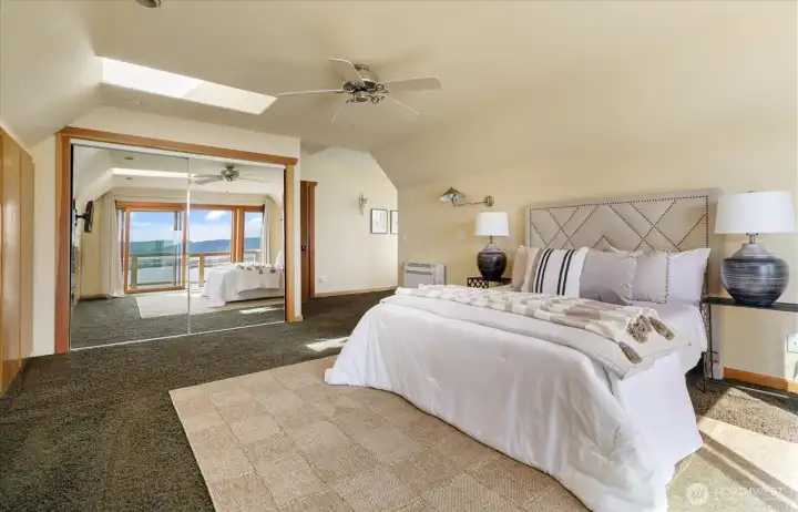 Upper level primary looking toward the entrance to the bath